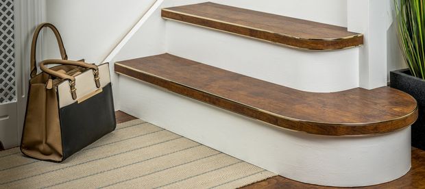 Modern stair design with curved stair nosing