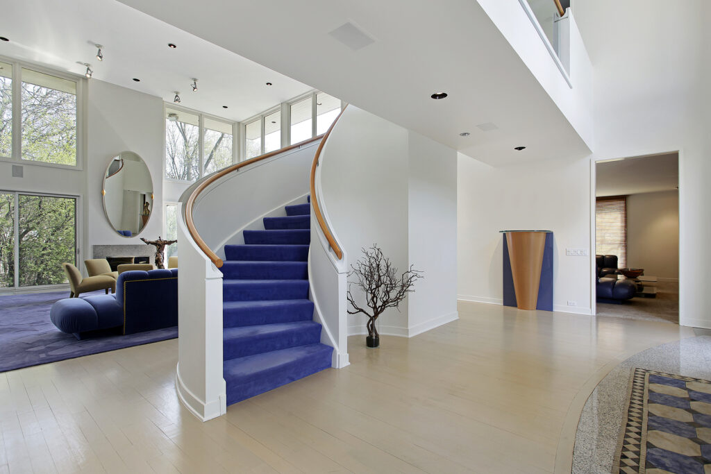 Coastal Staircase with blue stairs and white bannisters