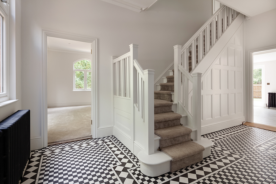 beautiful white wooden stairs with a tiled floor