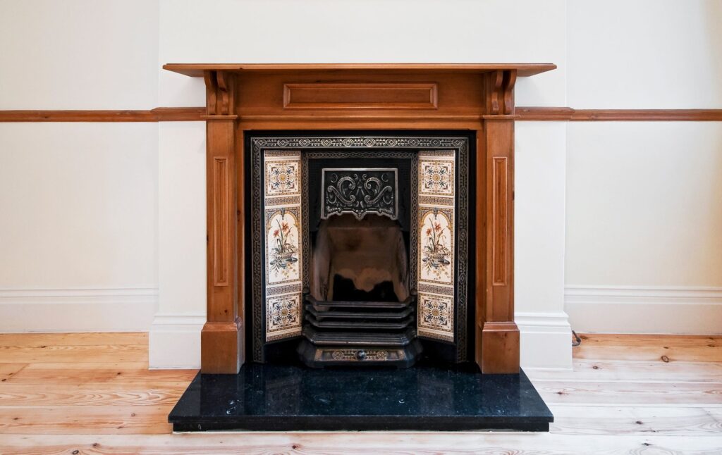 Victorian fireplace with wooden surrounds