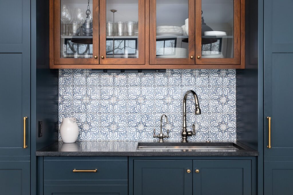 blue tile backsplash behind sink in modern kitchen 